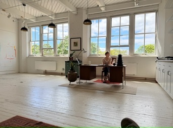 Big white studio with rows of windows