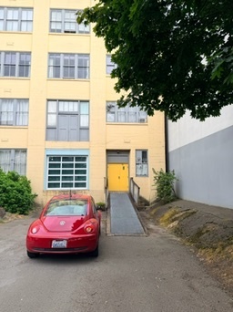 Street entrance with the yellow door