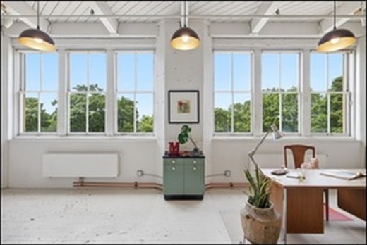Studio wall of windows and radiators