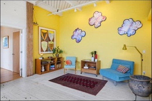 Yellow living room with blue chairs