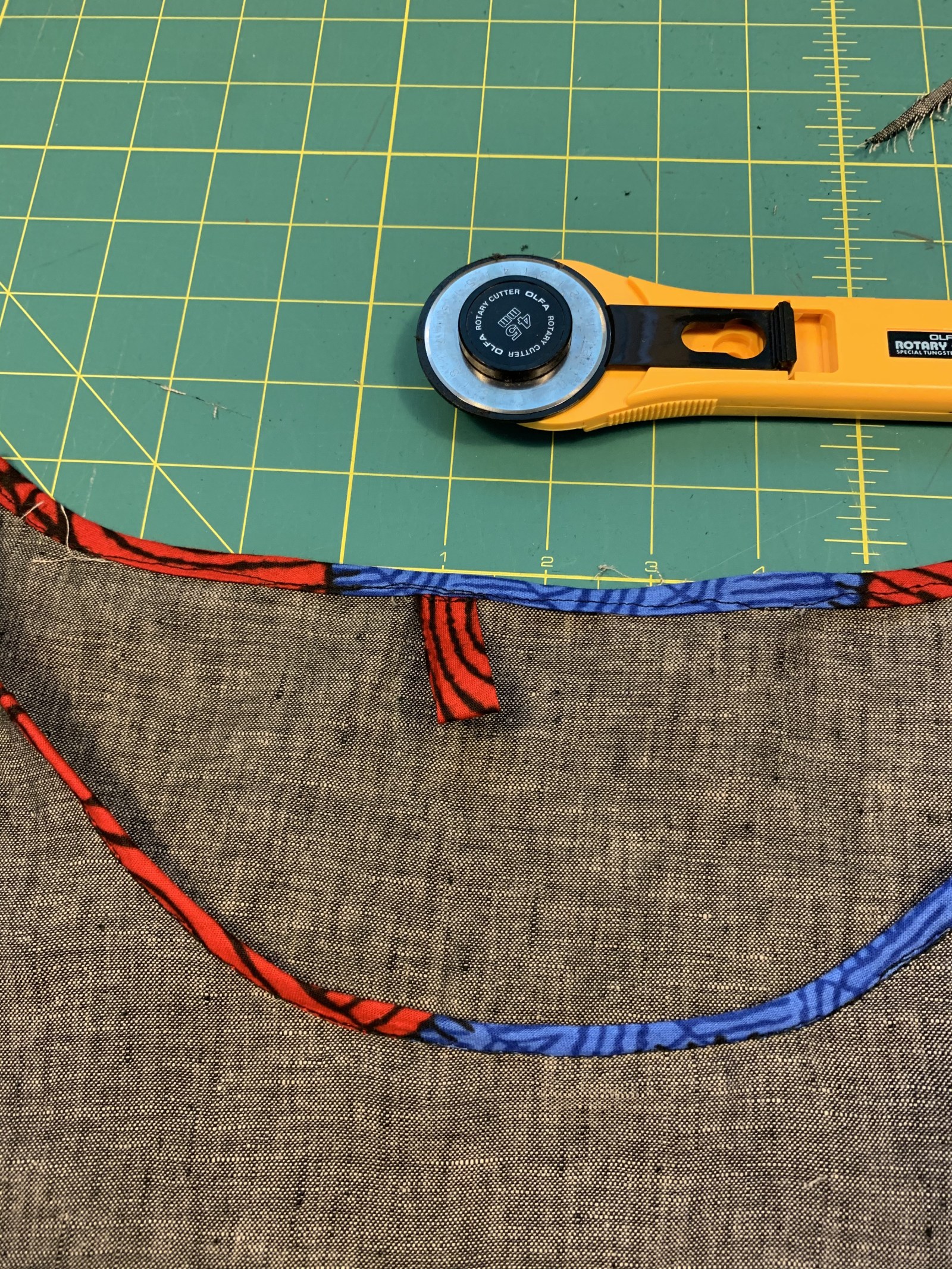 Binding on tunic